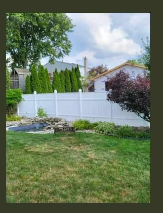 White vinyl privacy fence panel clean and bright after washing