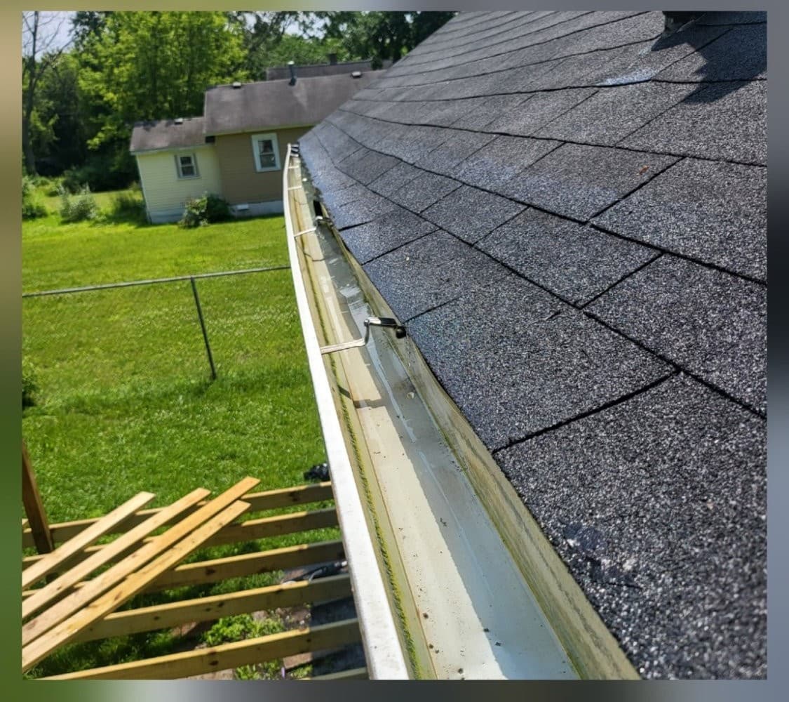 Gutter cleared and draining properly after professional gutter cleaning