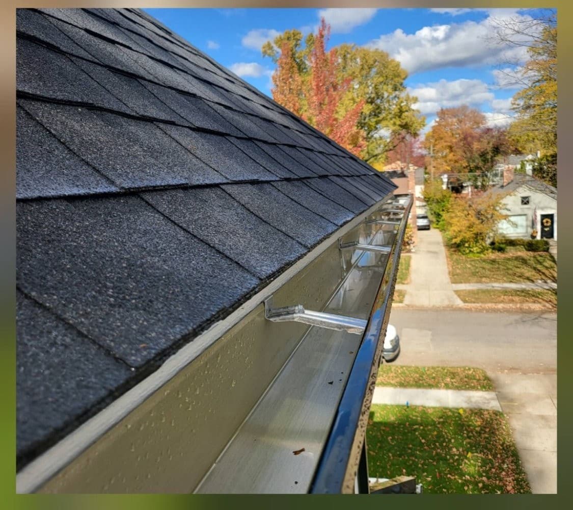 Clean gutters after service with clear blue sky