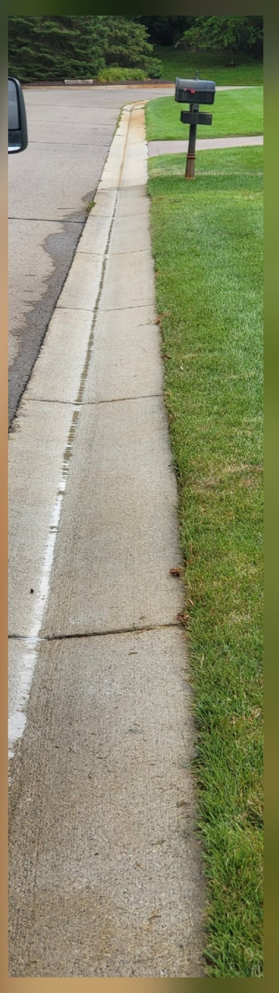 Curb bright and rust stains addressed after pressure washing