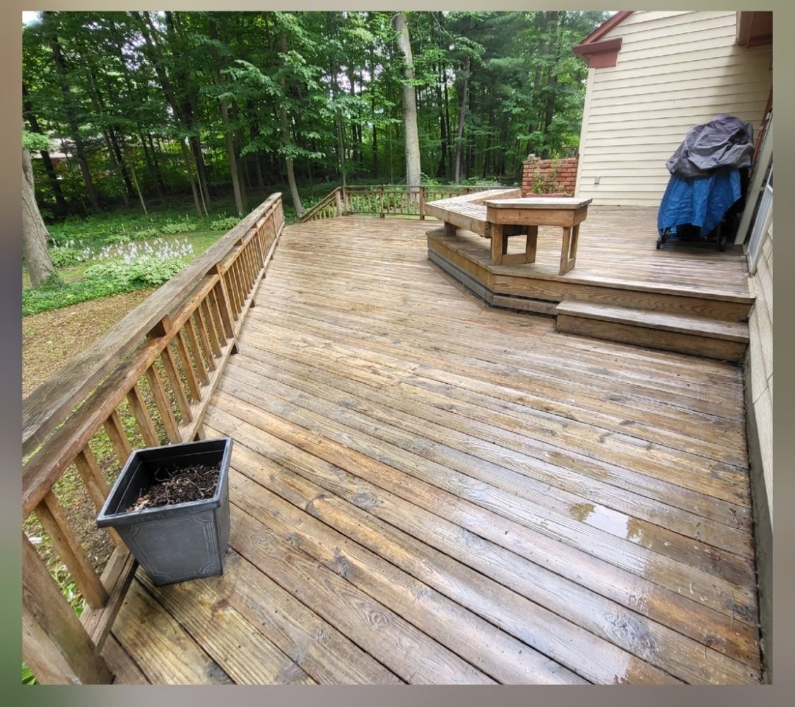 Wood deck restored to cleaner, brighter wood tones after washing