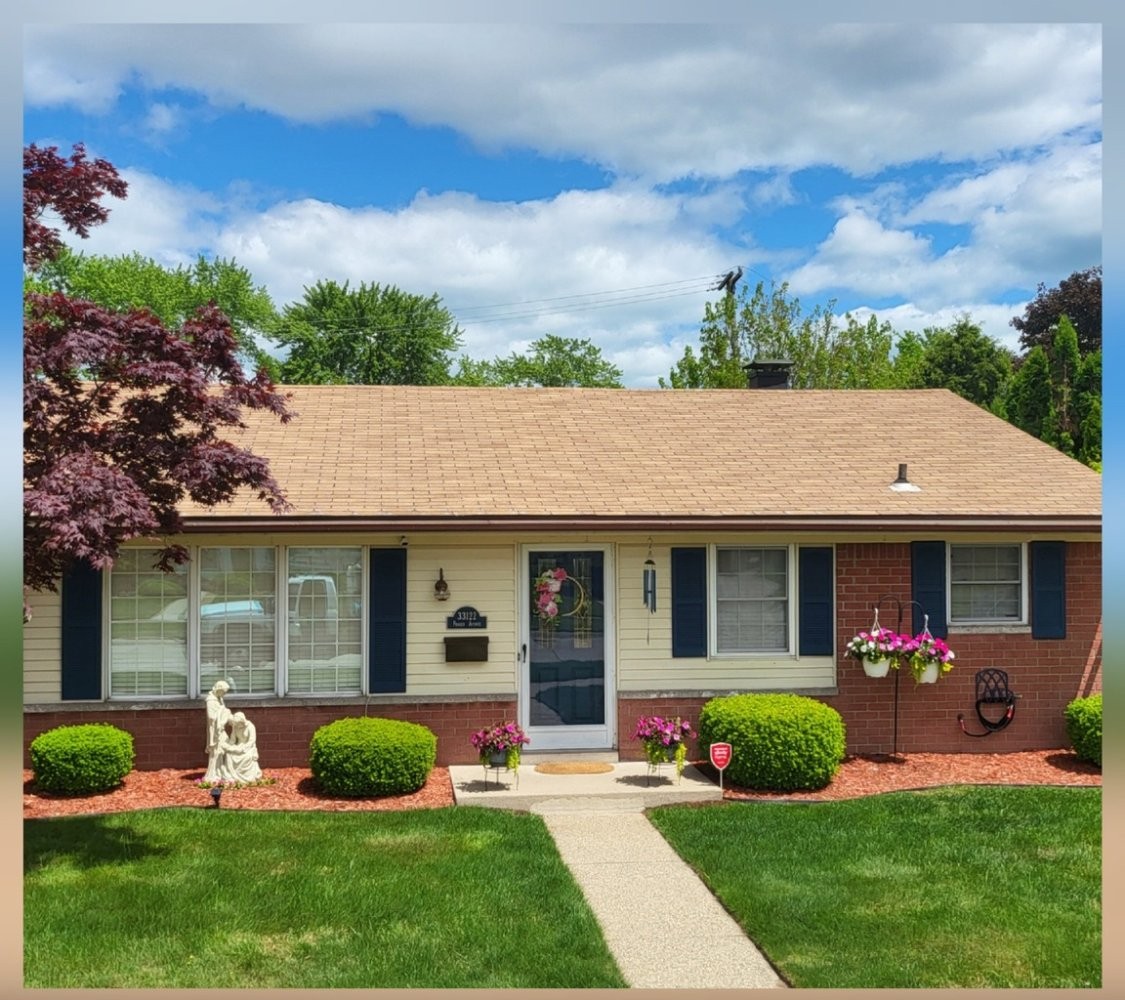 Residential roof clean and restored after professional roof cleaning