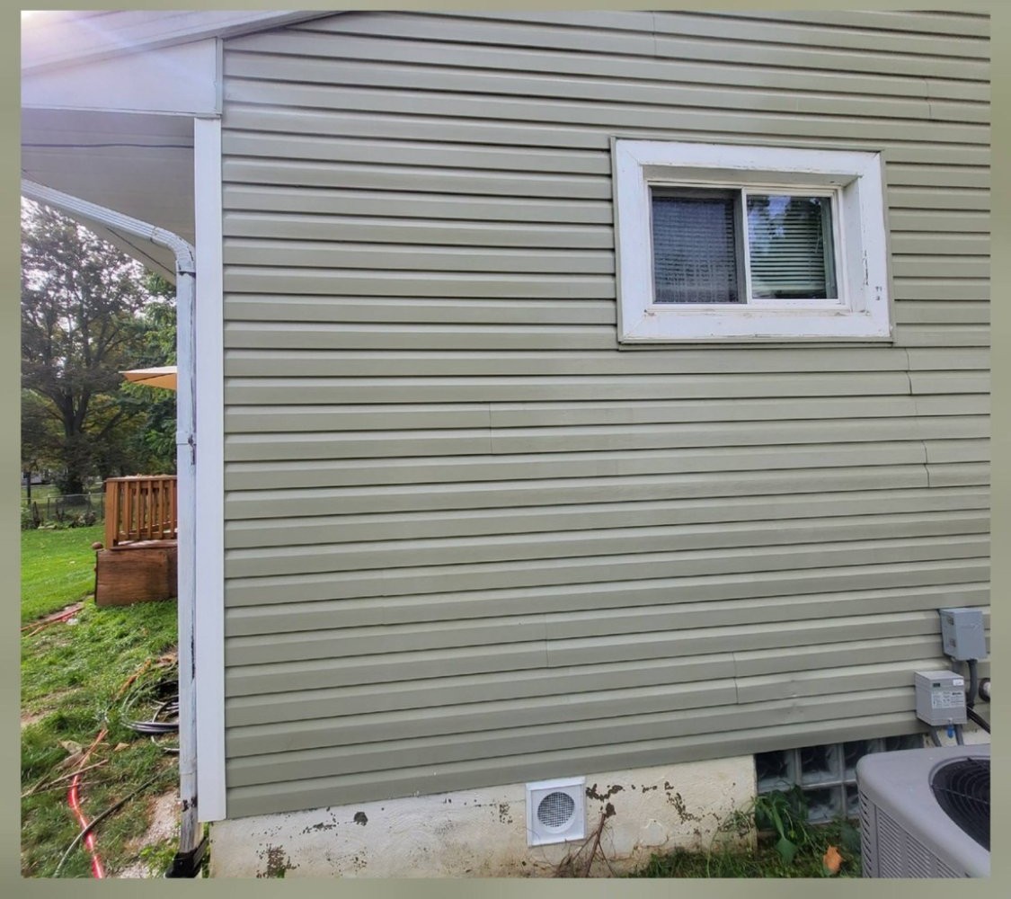 Sage siding restored and clean after soft washing